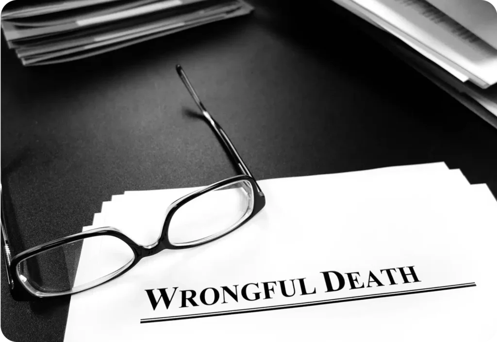 Document with "Wrongful Death" text and glasses on a desk.