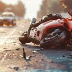 Wrecked motorcycle lying on road after fatal crash