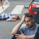 Man discussing fault with officer after car accident