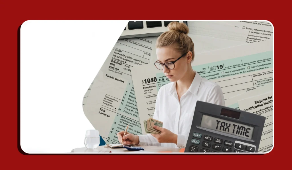 Woman calculating income tax returns surrounded by IRS forms, a calculator showing TAX TIME.