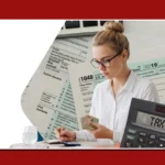 Woman calculating income tax returns surrounded by IRS forms, a calculator showing TAX TIME.